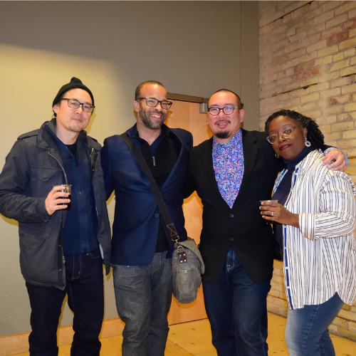 Image of Bao Phi standing with other local authors